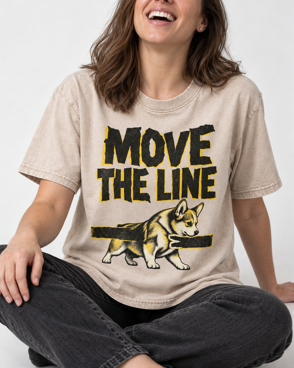 Corgi Move the Line Washed Tee in Apricot, worn by a seated model