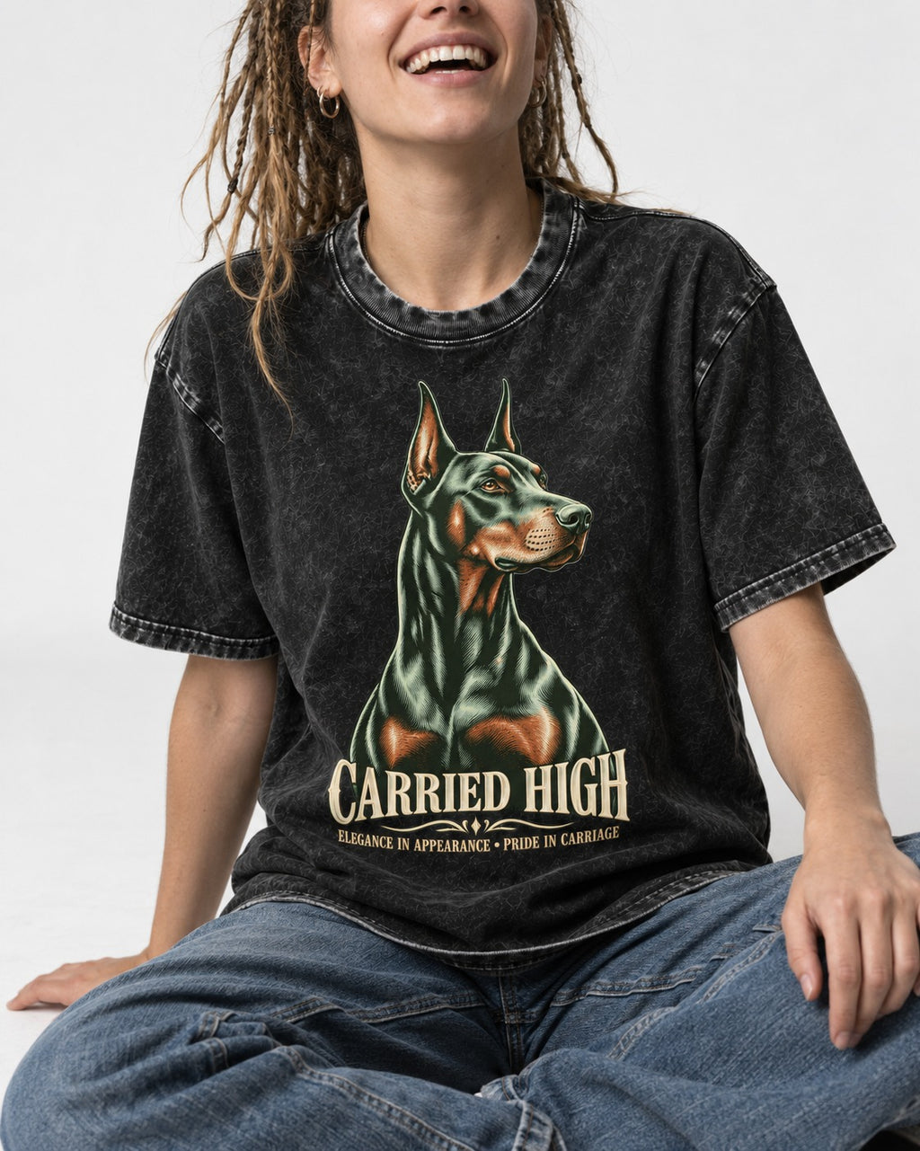 Doberman Carried High Portrait Graphic Washed Tee in Black, worn by a seated model