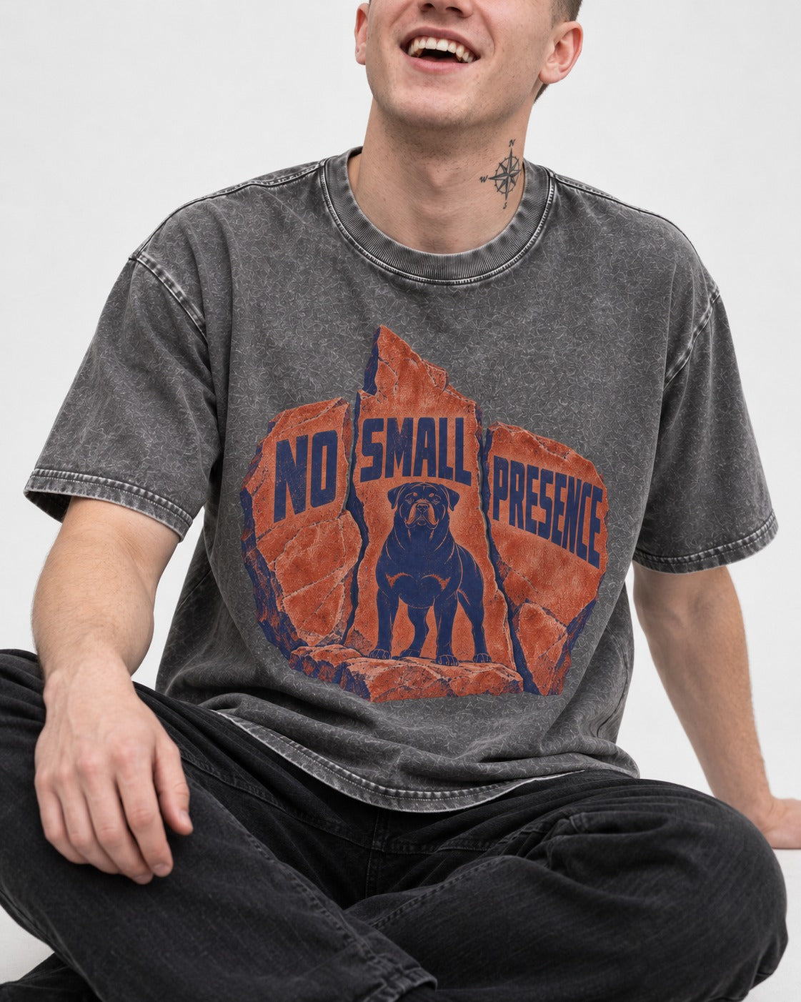 Rottweiler No Small Presence Monument Rock Graphic Washed Tee in Gray, worn by a seated model