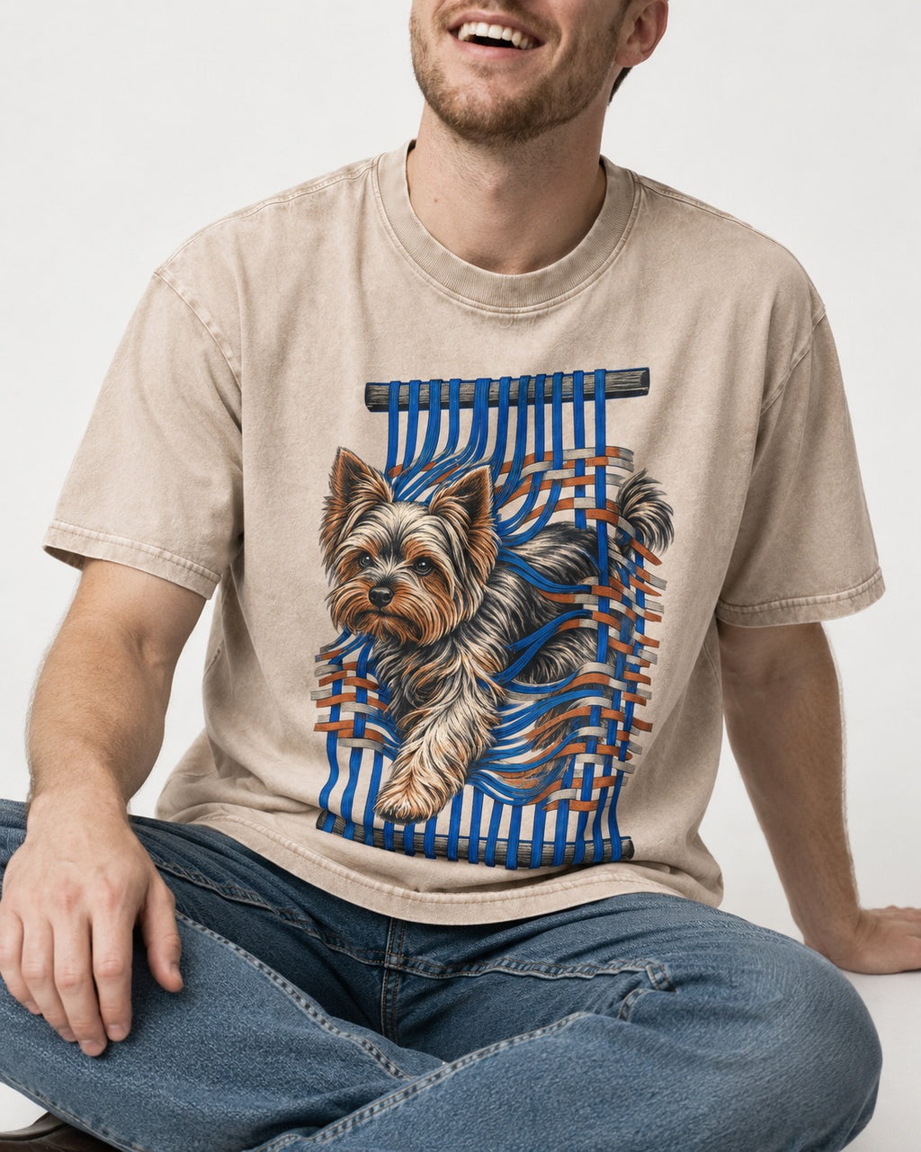 Yorkshire Terrier Unbound Washed Tee in Apricot, worn by a seated model