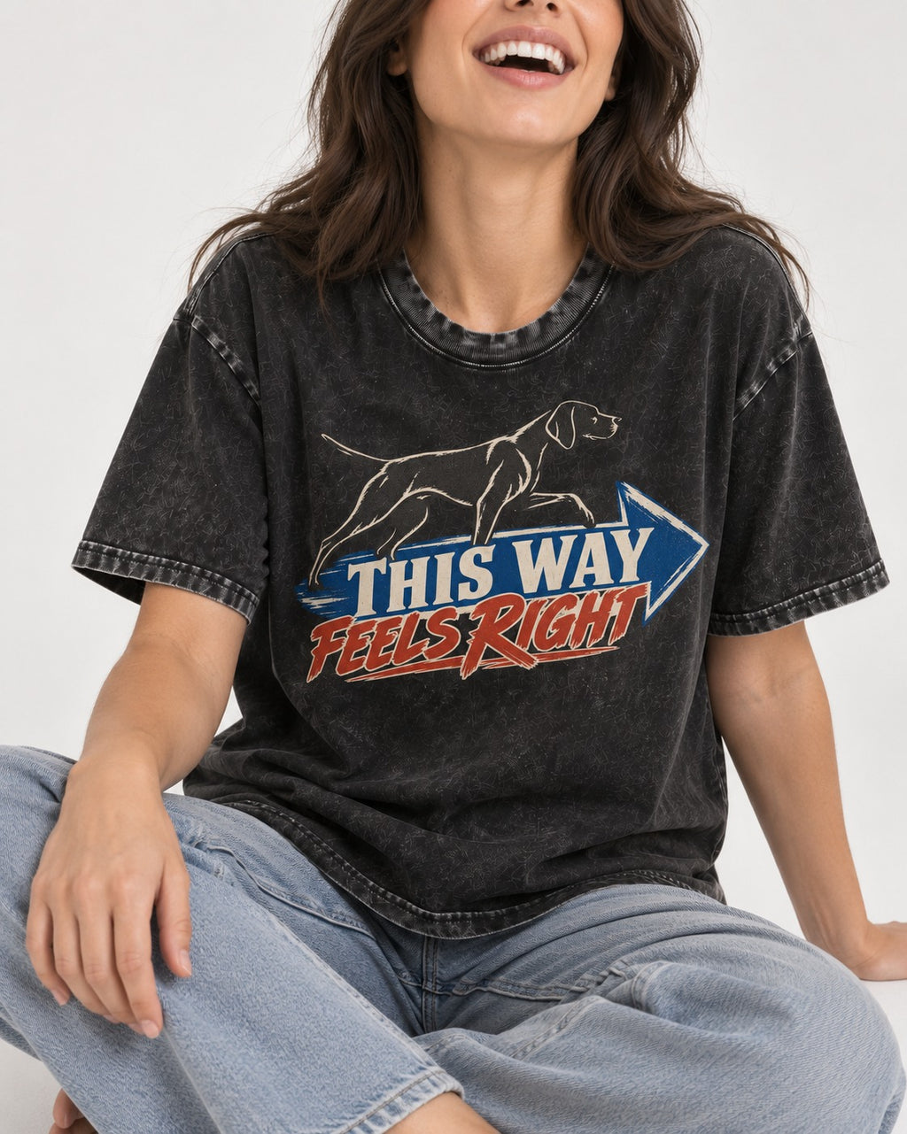 This Way Feels Right Arrow German Shorthaired Pointer Graphic Washed Tee in Black, worn by a seated model