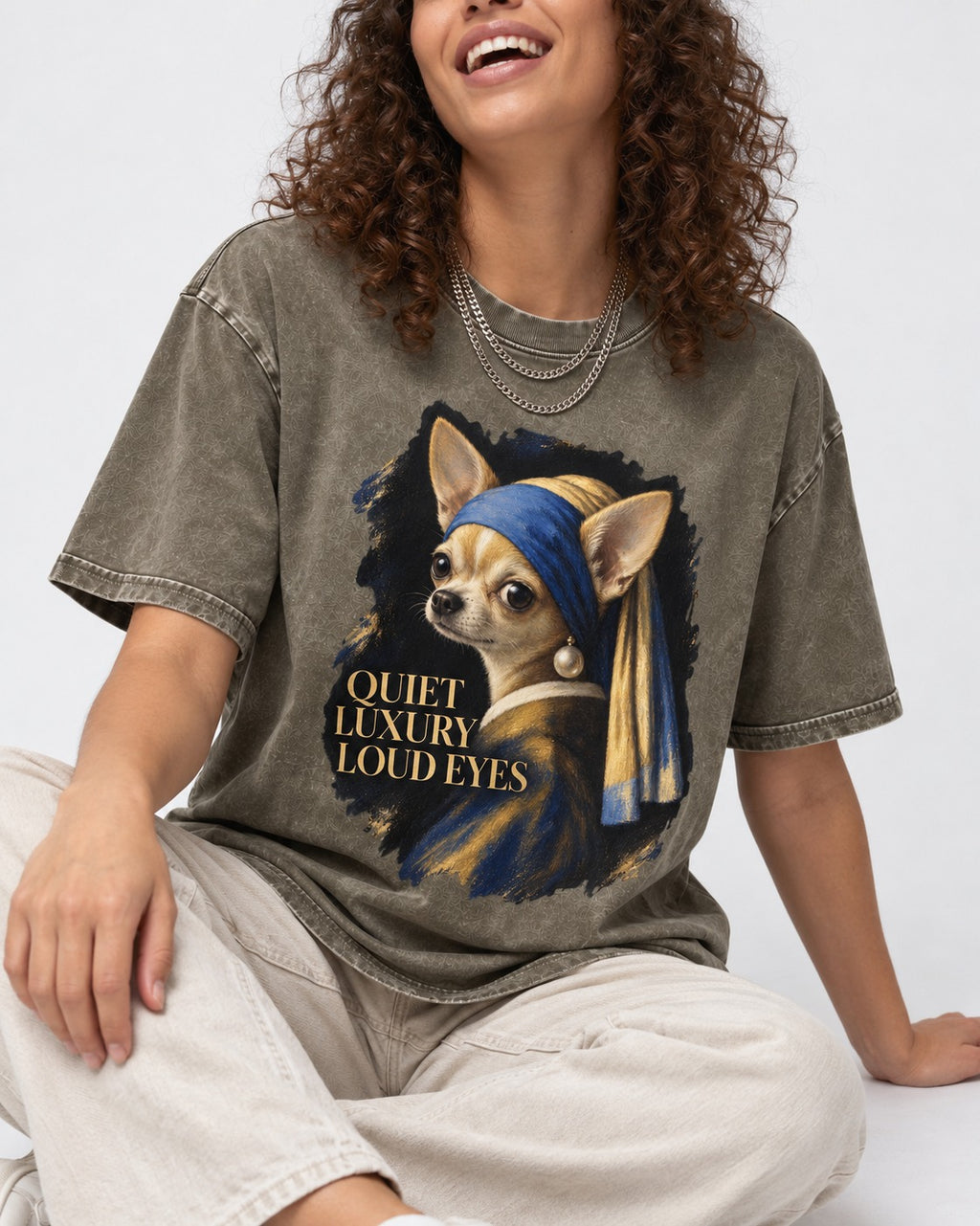 Chihuahua Quiet Luxury Loud Eyes Pearl Earring Portrait Washed Tee in Army Green, worn by a seated model