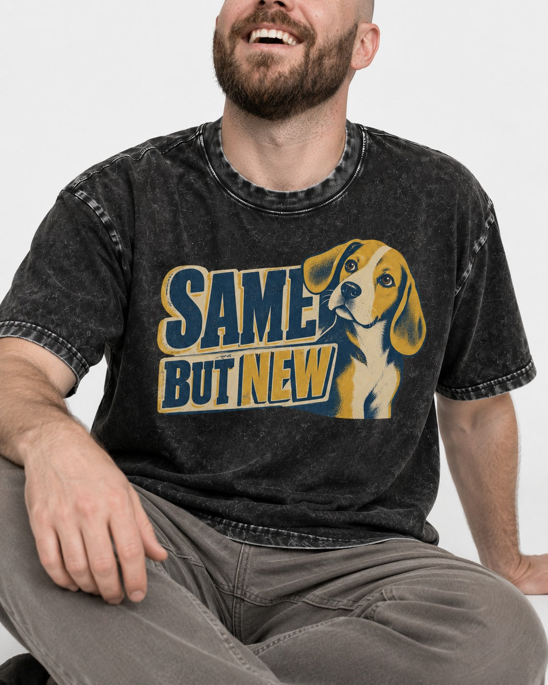 Same Beagle But New Washed Tee in Black, worn by a seated model