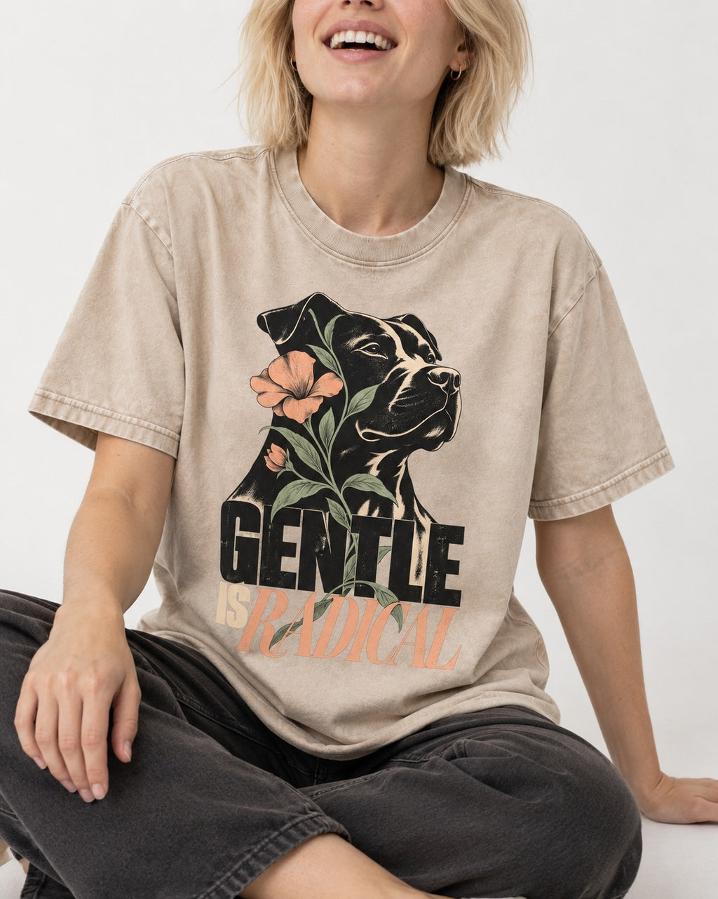 Gentle Pitbull Is Radical Washed Tee in Apricot, worn by a seated model