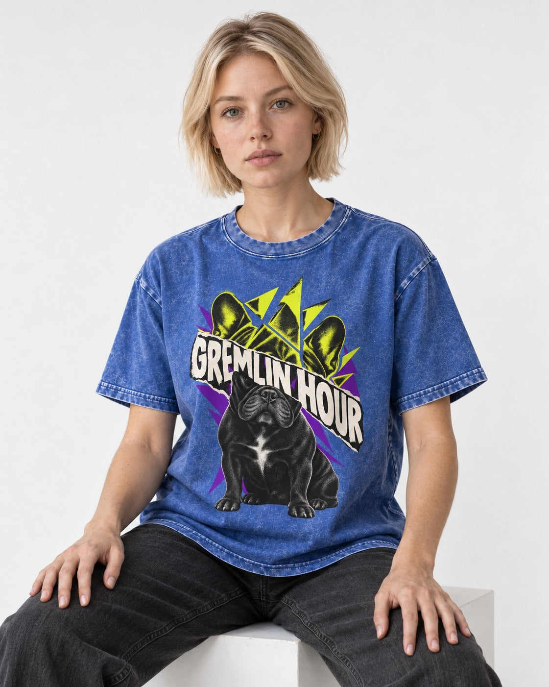 Frenchie Gremlin Hour Fracture Portrait Graphic Washed Tee in Royal Blue, worn by a seated model