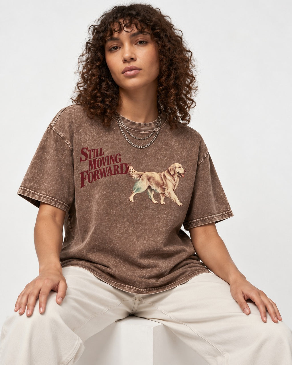 Golden Retriever Still Moving Forward Washed Tee in Coffee, worn by a seated model