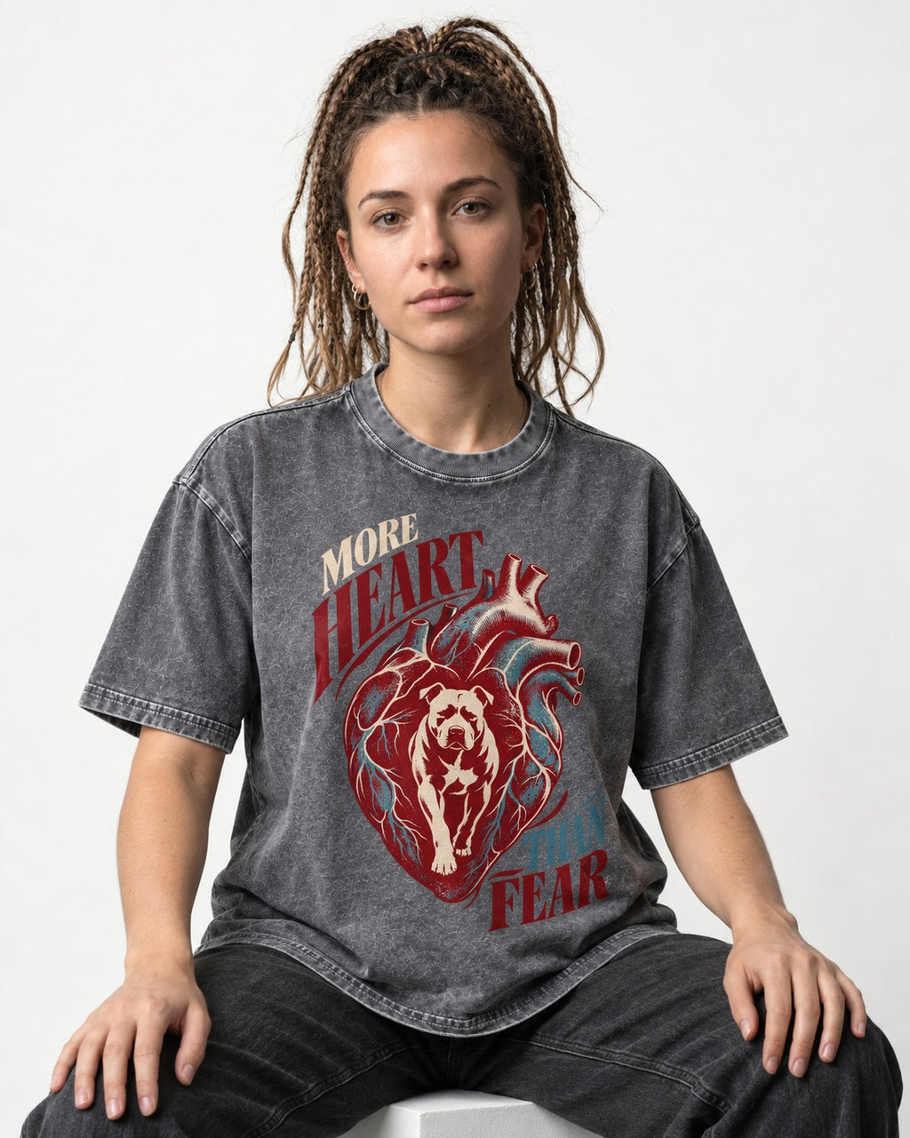 Pitbull More Heart Than Fear Anatomical Heart Graphic Washed Tee in Gray, worn by a seated model