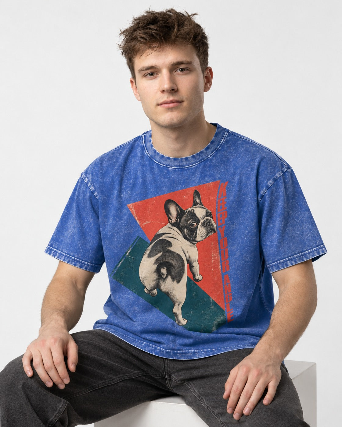 Frenchie Keep Your Angle Geometric Graphic Washed Tee in Royal Blue, worn by a seated model