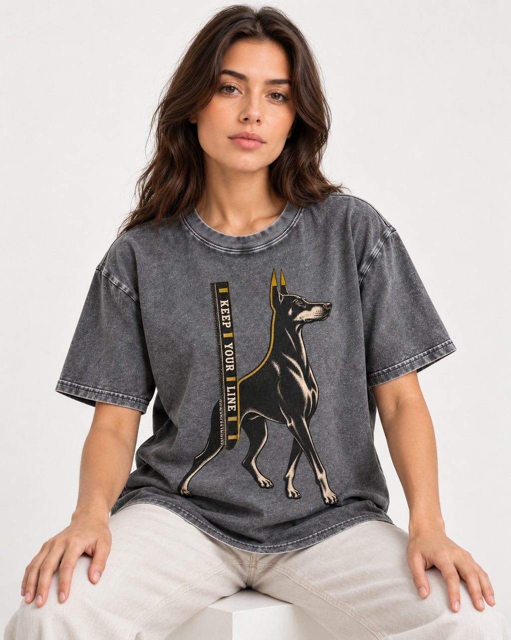 Keep Your Line Doberman Washed Tee in Gray, worn by a seated model
