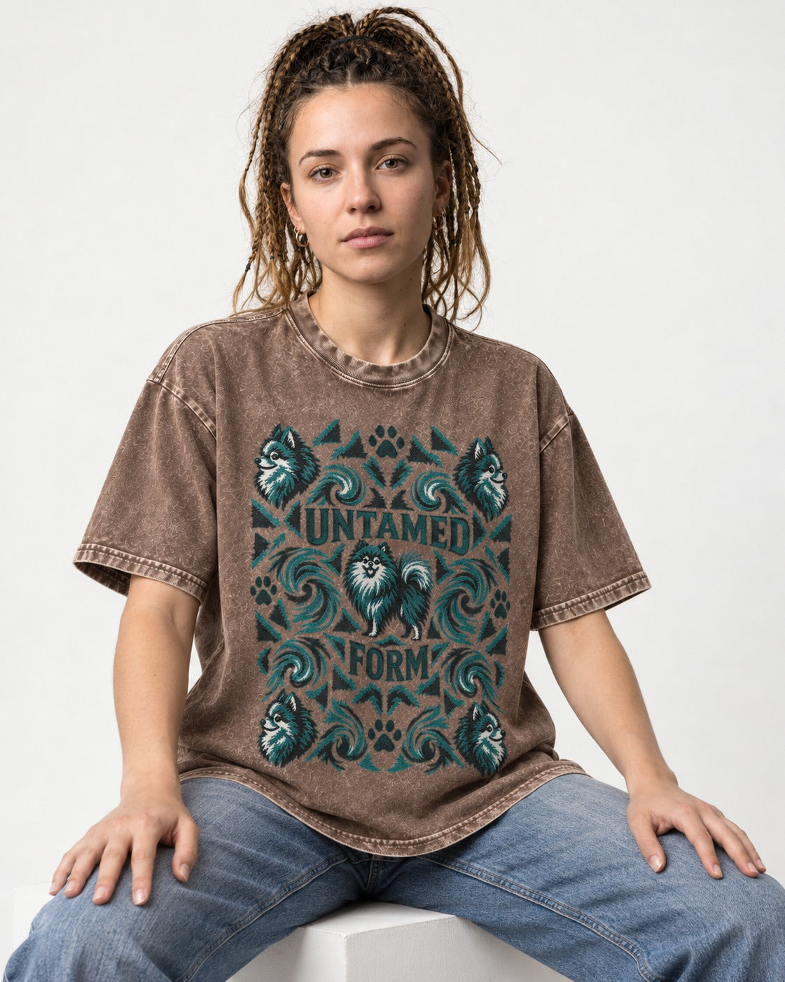 Pomeranian Untamed Form Washed Tee in Coffee, worn by a seated model