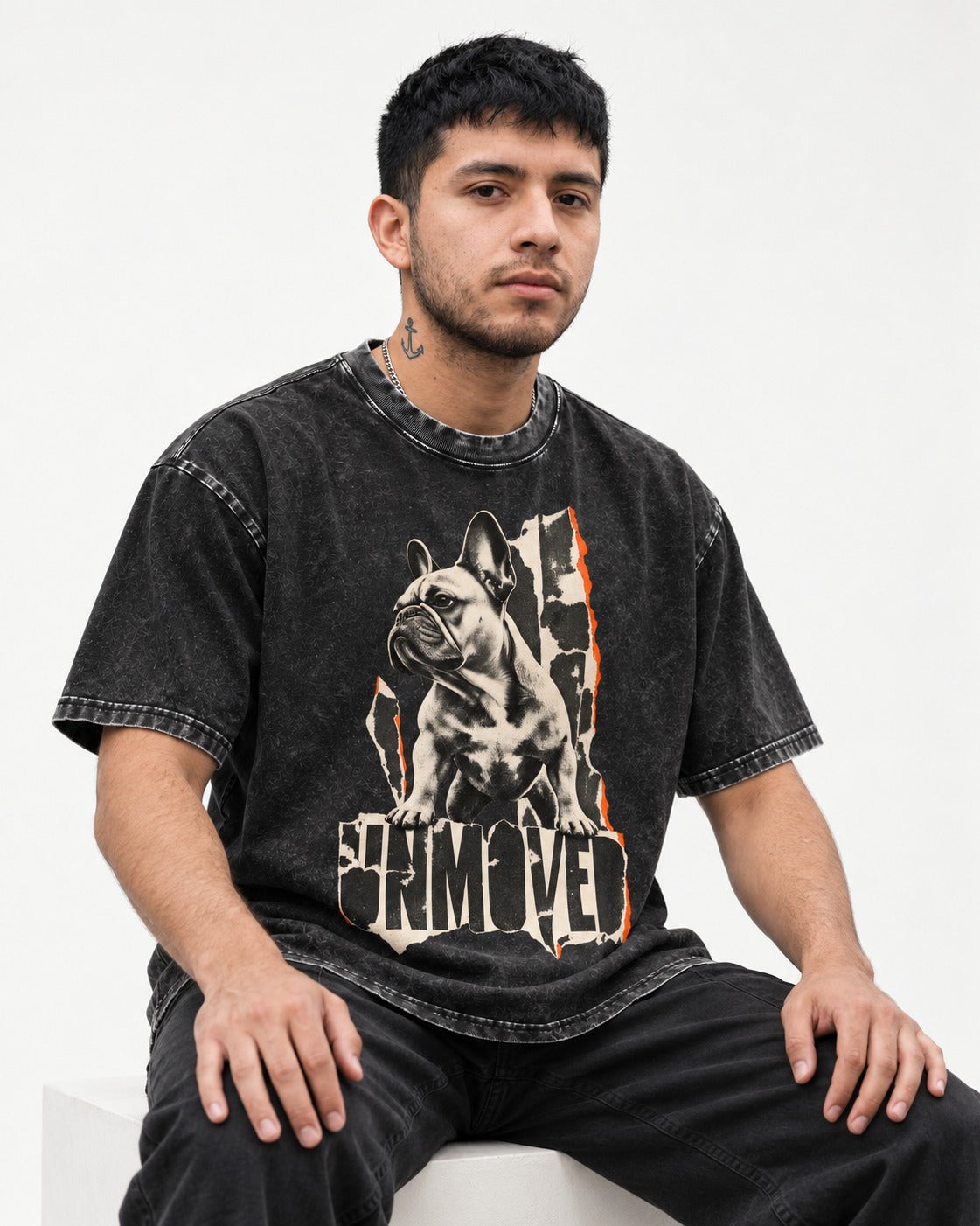 Frenchie Unmoved Torn Poster Graphic Washed Tee in Black, worn by a seated model