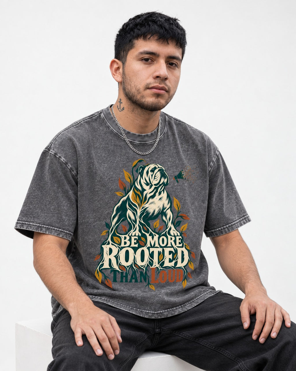 More Rooted Than Loud English Bulldog Washed Tee in Gray, worn by a seated model
