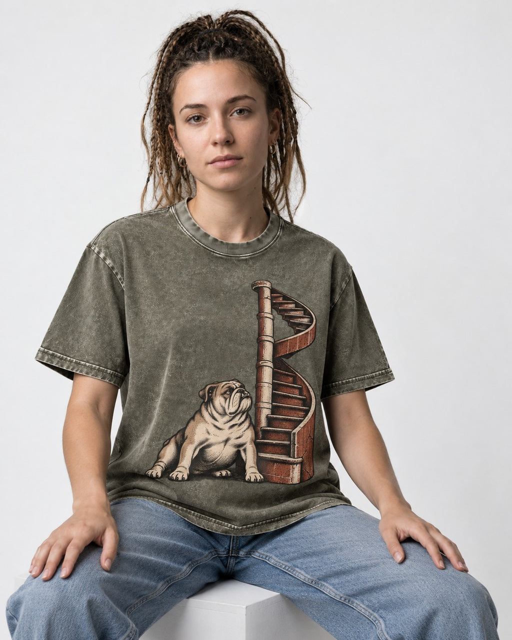 English Bulldog Spiral Staircase Graphic Washed Tee in Army Green, worn by a seated model