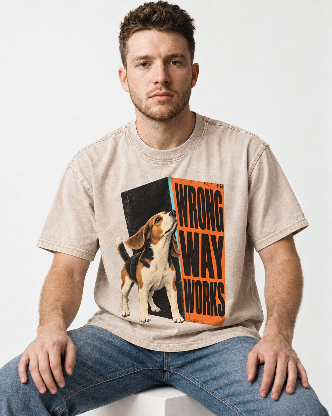Beagle Wrong Way Works Washed Tee in Apricot, worn by a seated model