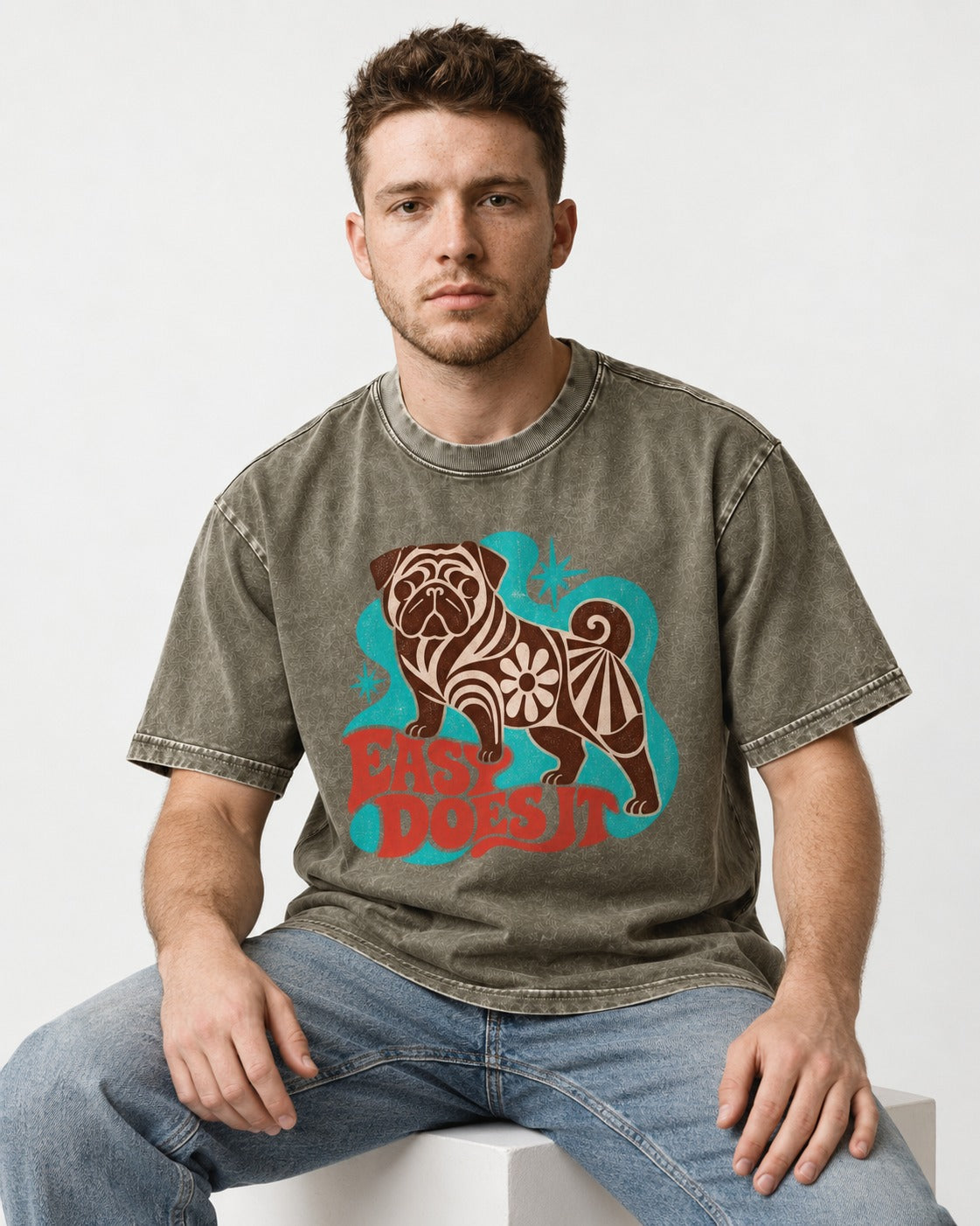Pug Easy Does It Retro Floral Graphic Washed Tee in Army Green, worn by a seated model