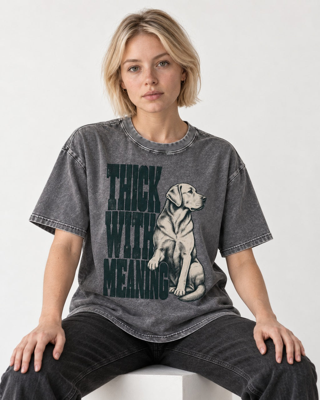 Thick with Meaning Labrador Retriever Washed Tee in Gray, worn by a seated model