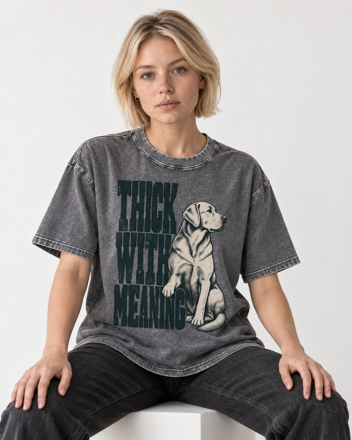 Thick with Meaning Labrador Retriever Washed Tee in Gray, worn by a seated model