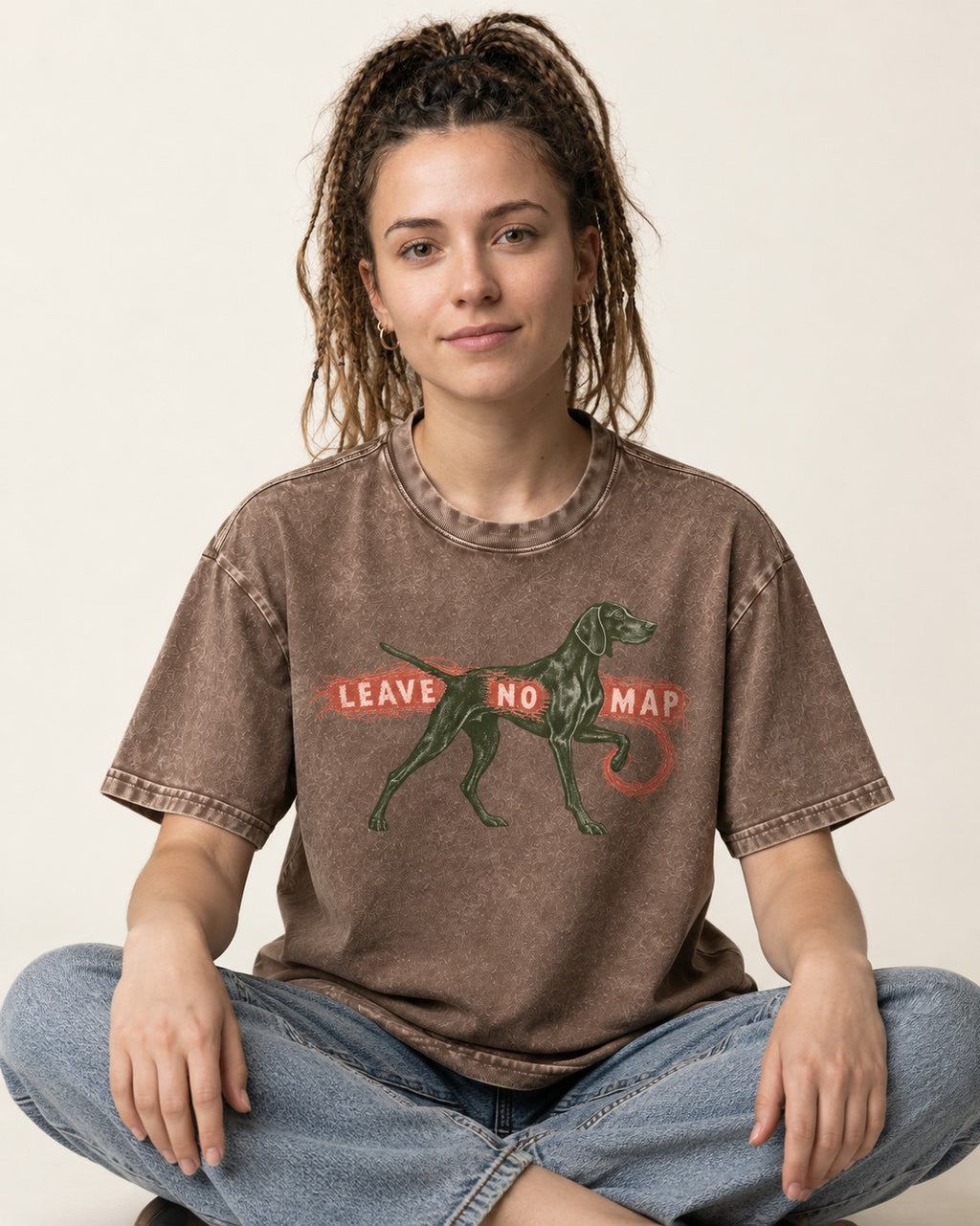 Leave No Map German Shorthaired Pointer Washed Tee in Coffee, worn by a seated model