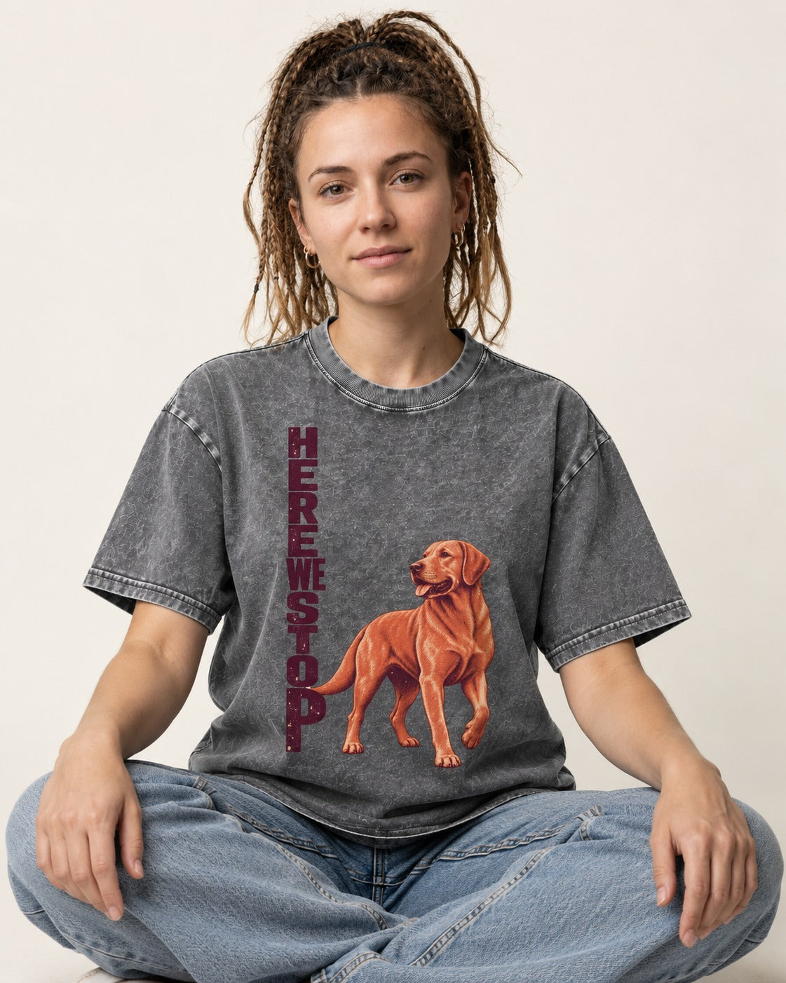 Here We Stop Labrador Retriever Washed Tee in Gray, worn by a seated model