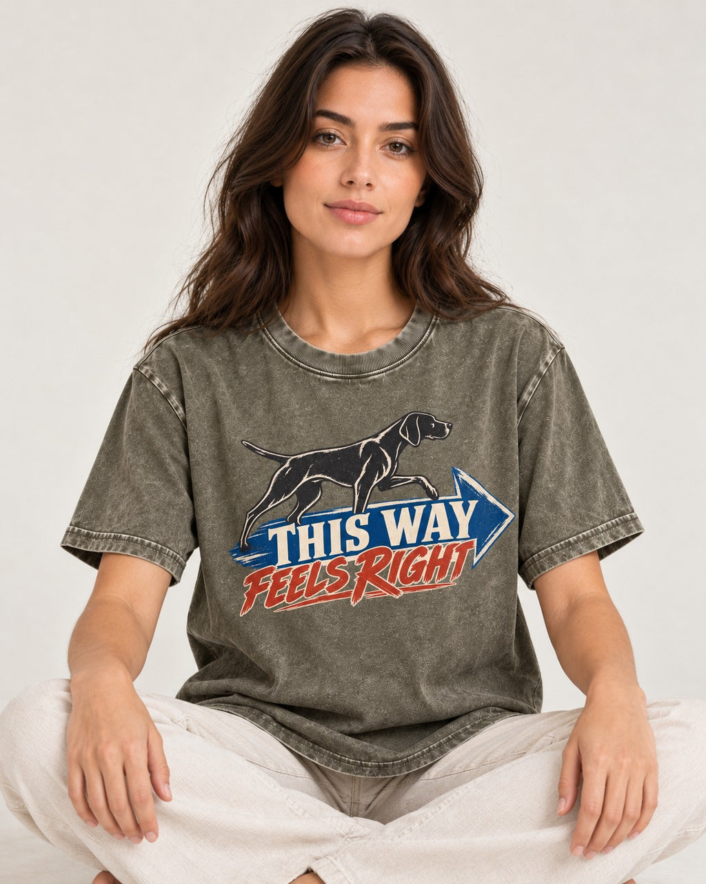 This Way Feels Right Arrow German Shorthaired Pointer Graphic Washed Tee in Army Green, worn by a seated model