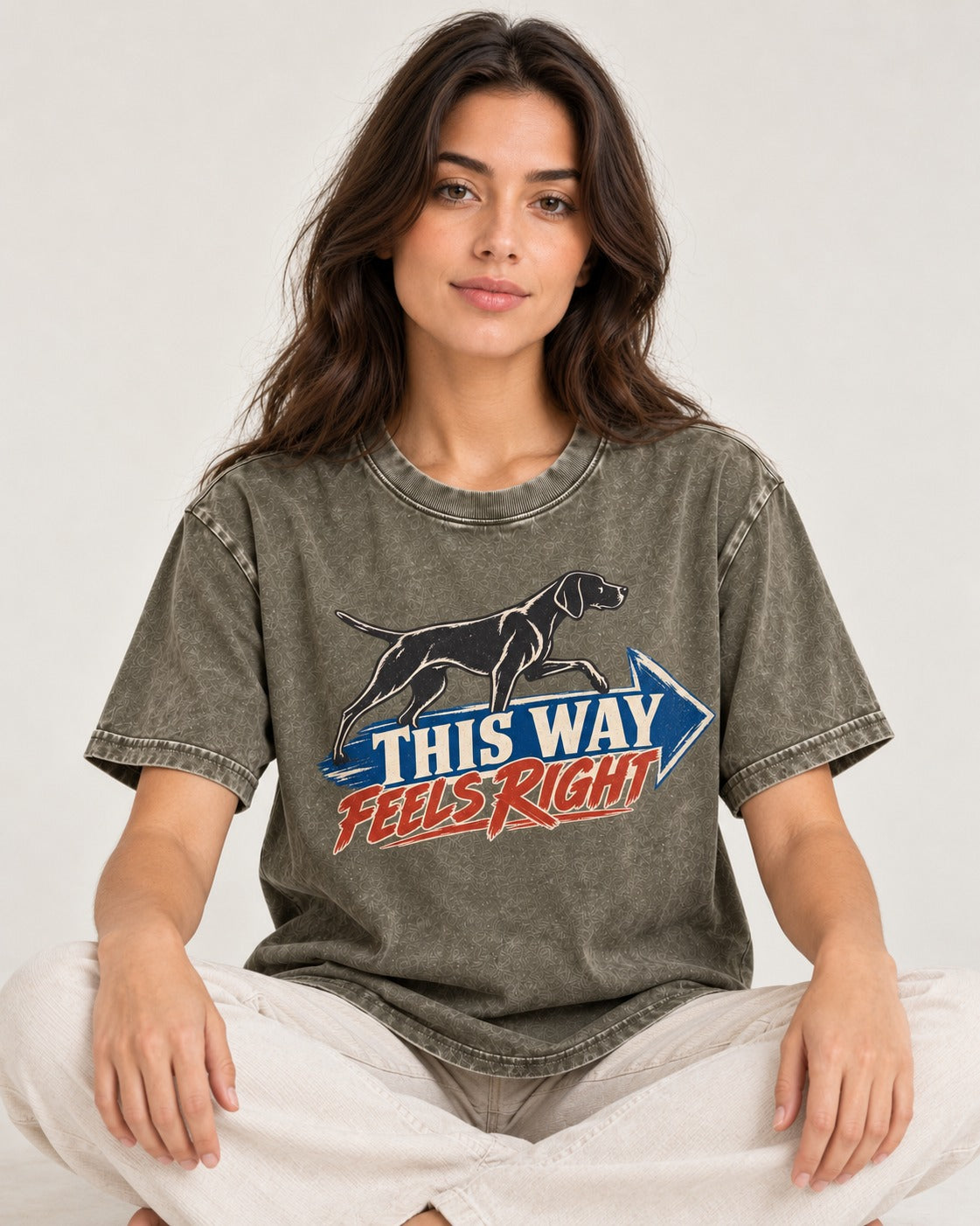 This Way Feels Right Arrow German Shorthaired Pointer Graphic Washed Tee in Army Green, worn by a seated model