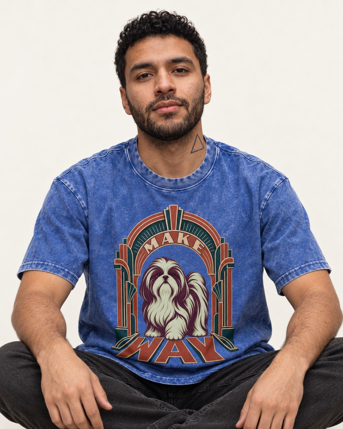 Shih Tzu Make Way Art Deco Arch Portrait Washed Tee in Royal Blue, worn by a seated model