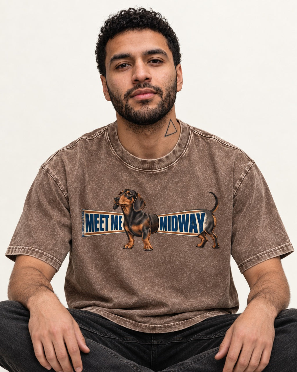 Dachshund Meet Me Midway Washed Tee in Coffee, worn by a seated model