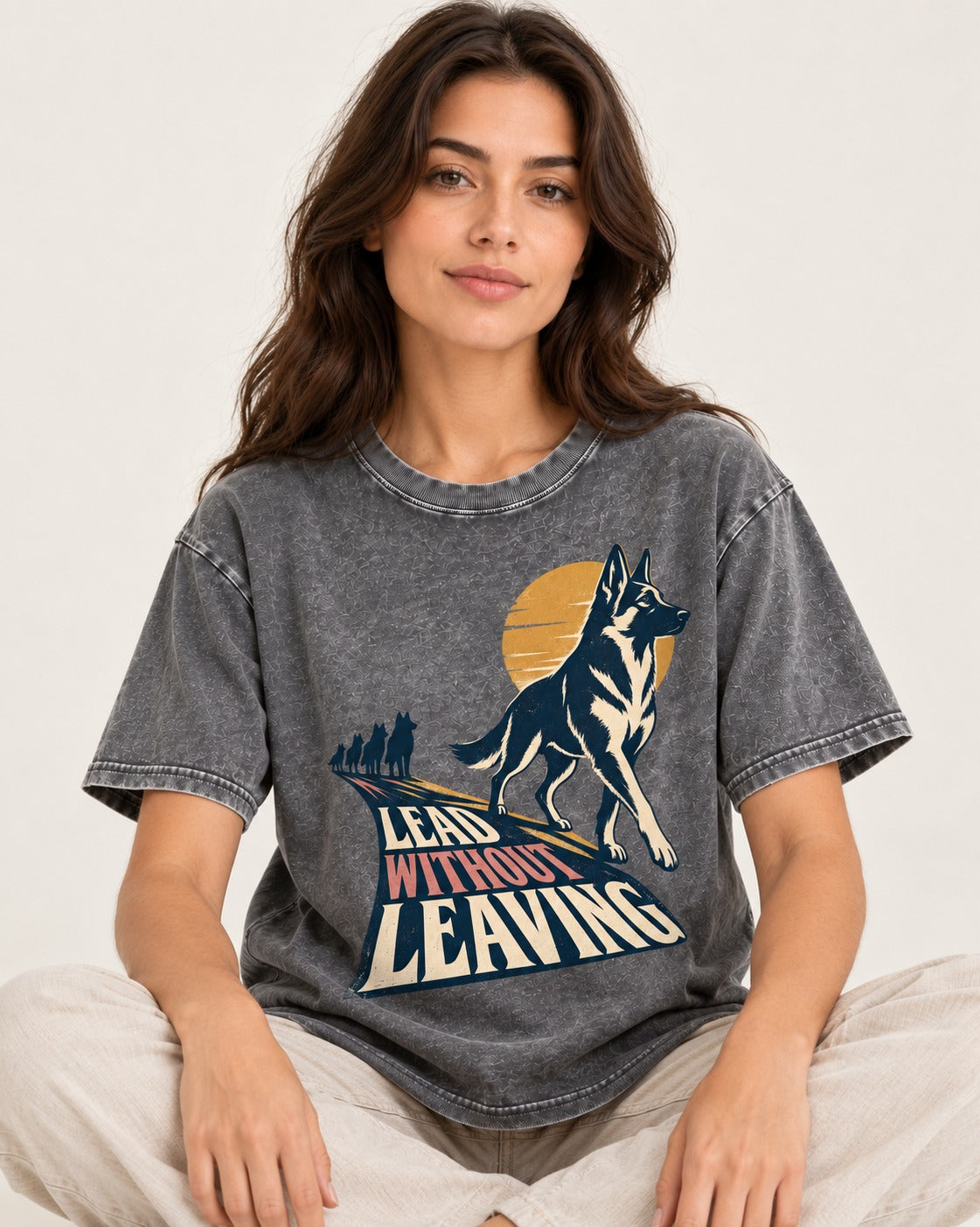 Lead Without Leaving Perspective German Shepherd Dog Graphic Washed Tee in Gray, worn by a seated model