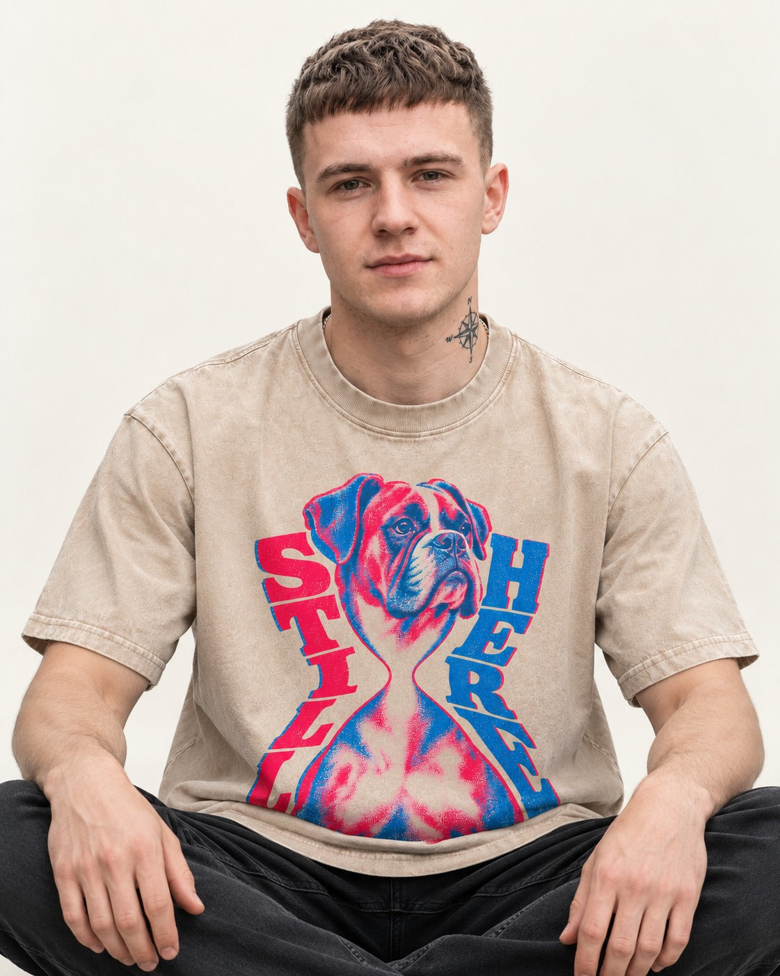 Stay Here Boxer Duotone Portrait Washed Tee in Apricot, worn by a seated model