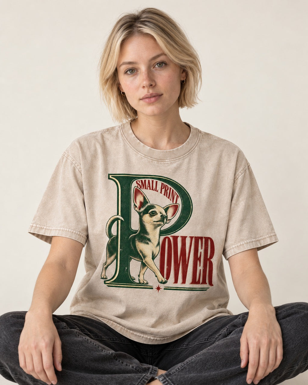 Chihuahua Small Print Power Monogram Graphic Washed Tee in Apricot, worn by a seated model