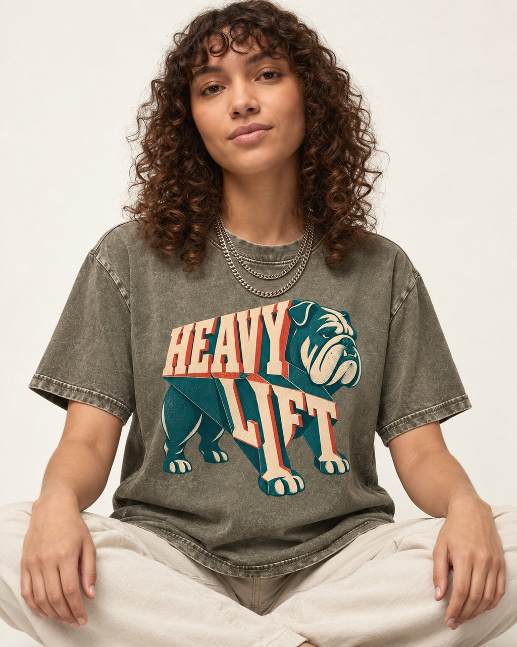 English Bulldog Heavy Lift Dimensional Type Washed Tee in Army Green, worn by a seated model