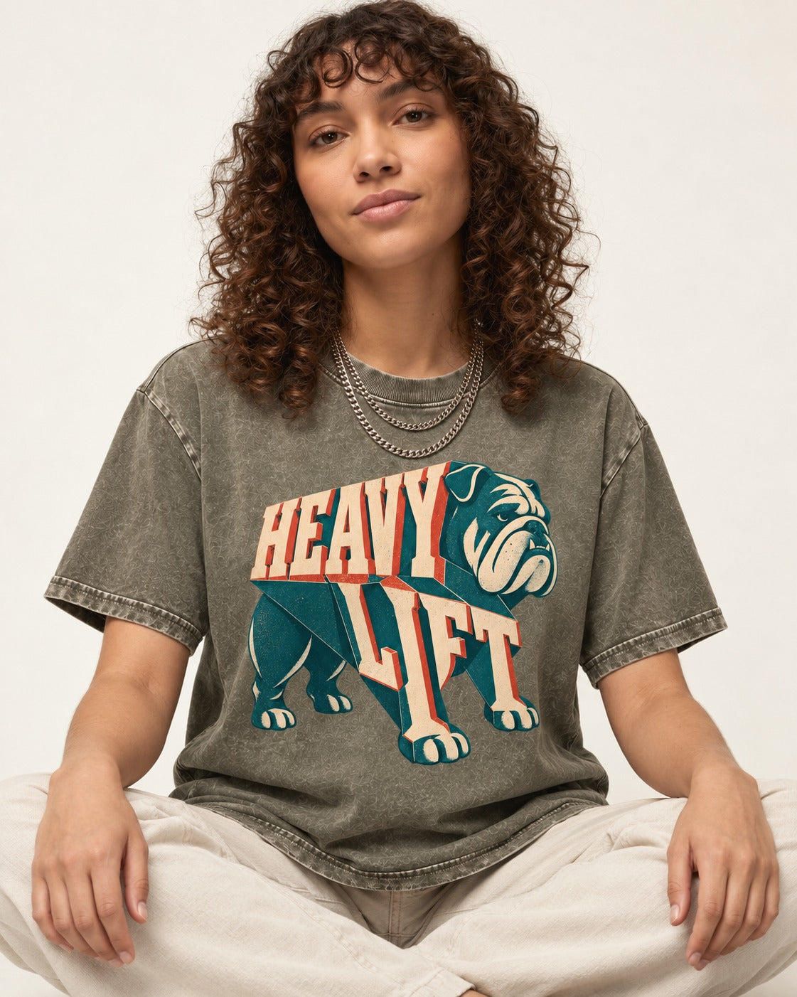 English Bulldog Heavy Lift Dimensional Type Washed Tee in Army Green, worn by a seated model