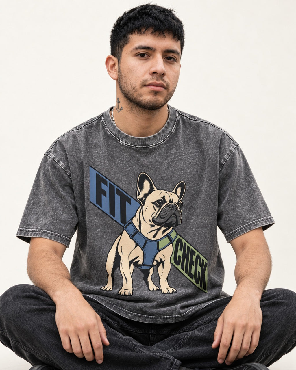 Frenchie Fit Check Washed Tee in Gray, worn by a seated model