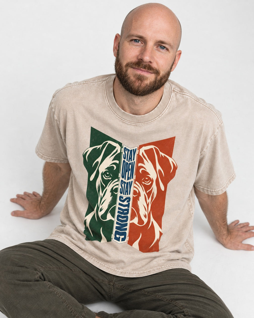 Boxer Stay Open Stay Strong Washed Tee in Apricot, worn by a seated model