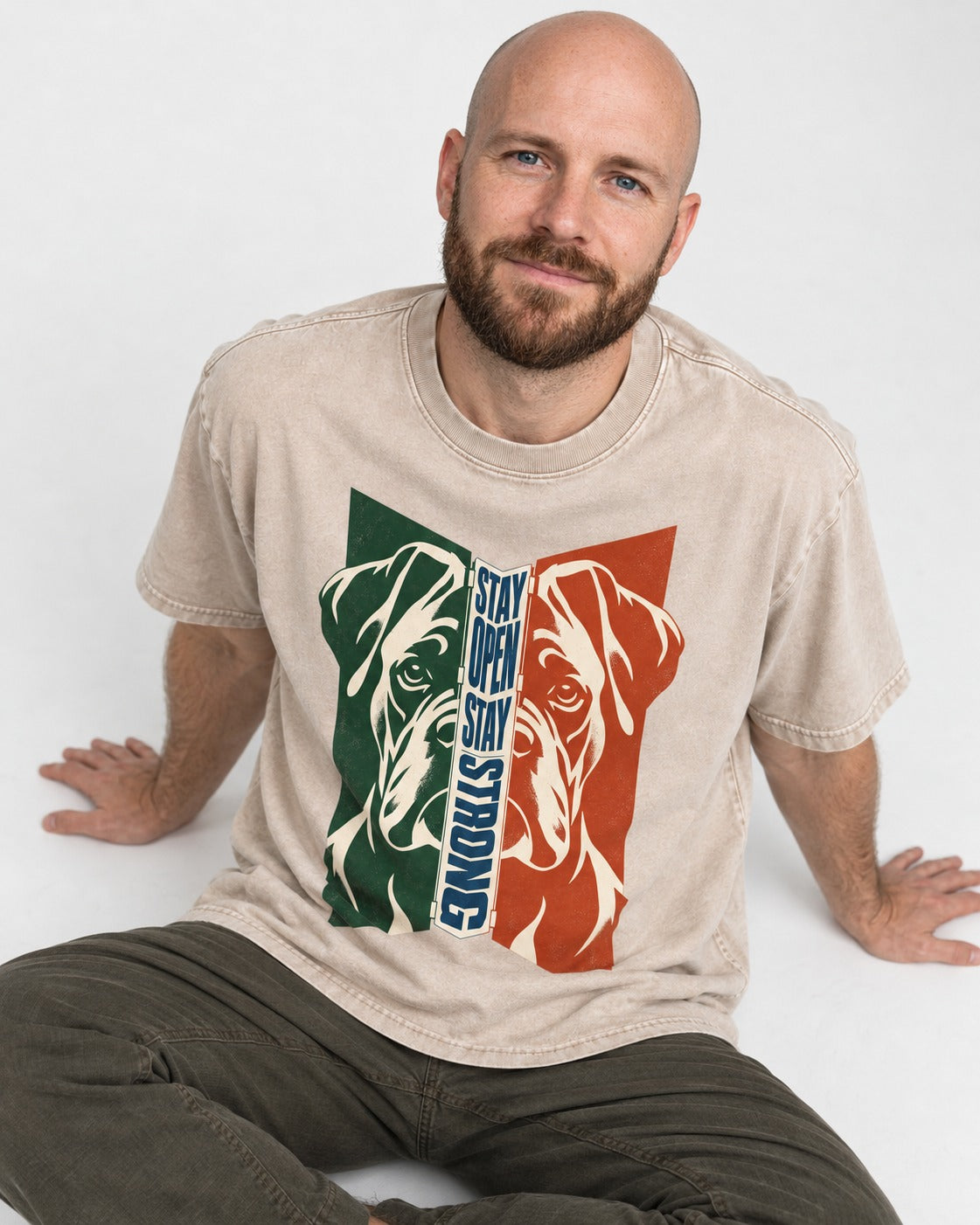 Boxer Stay Open Stay Strong Washed Tee in Apricot, worn by a seated model