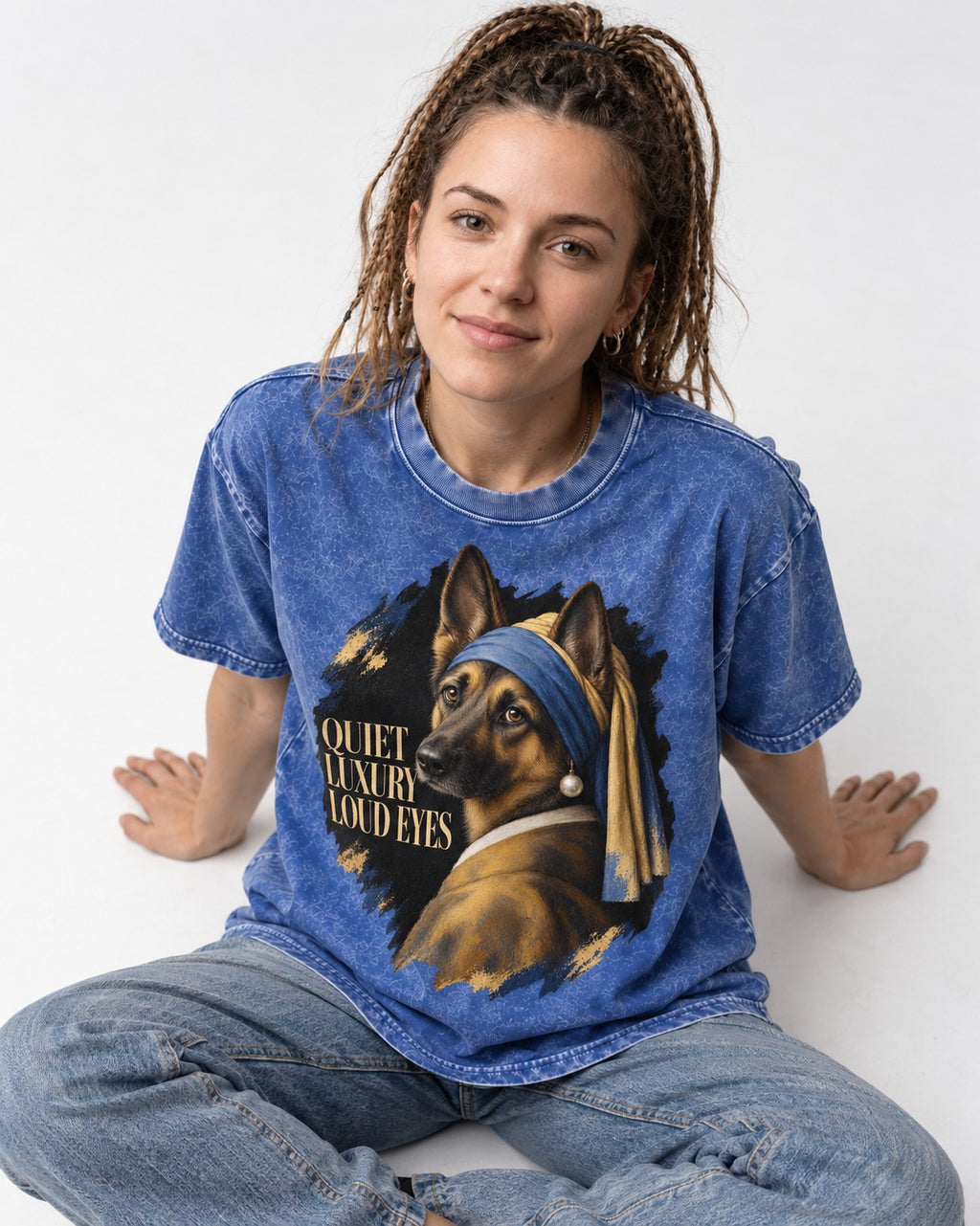 German Shepherd Dog Quiet Luxury Loud Eyes Pearl Portrait Washed Tee in Royal Blue, worn by a seated model