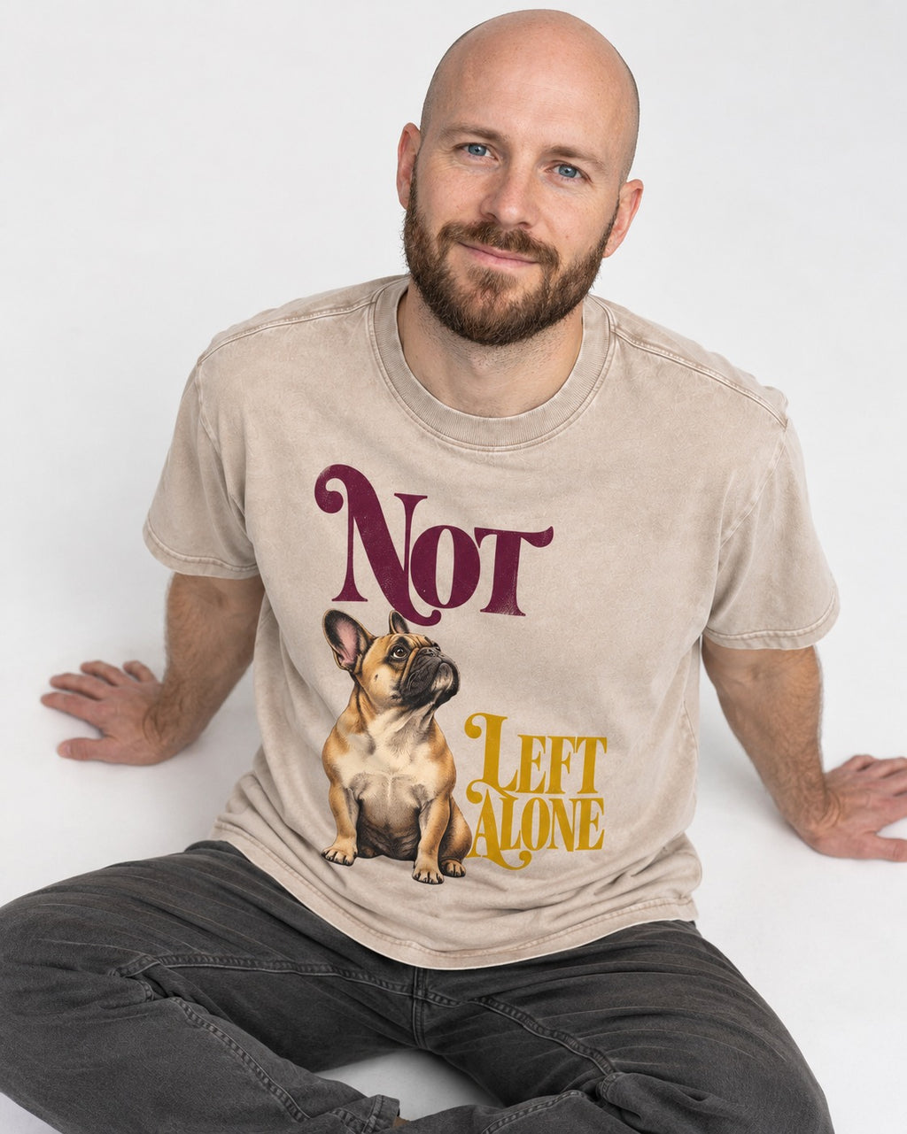 Frenchie Not Left Alone Washed Tee in Apricot, worn by a seated model