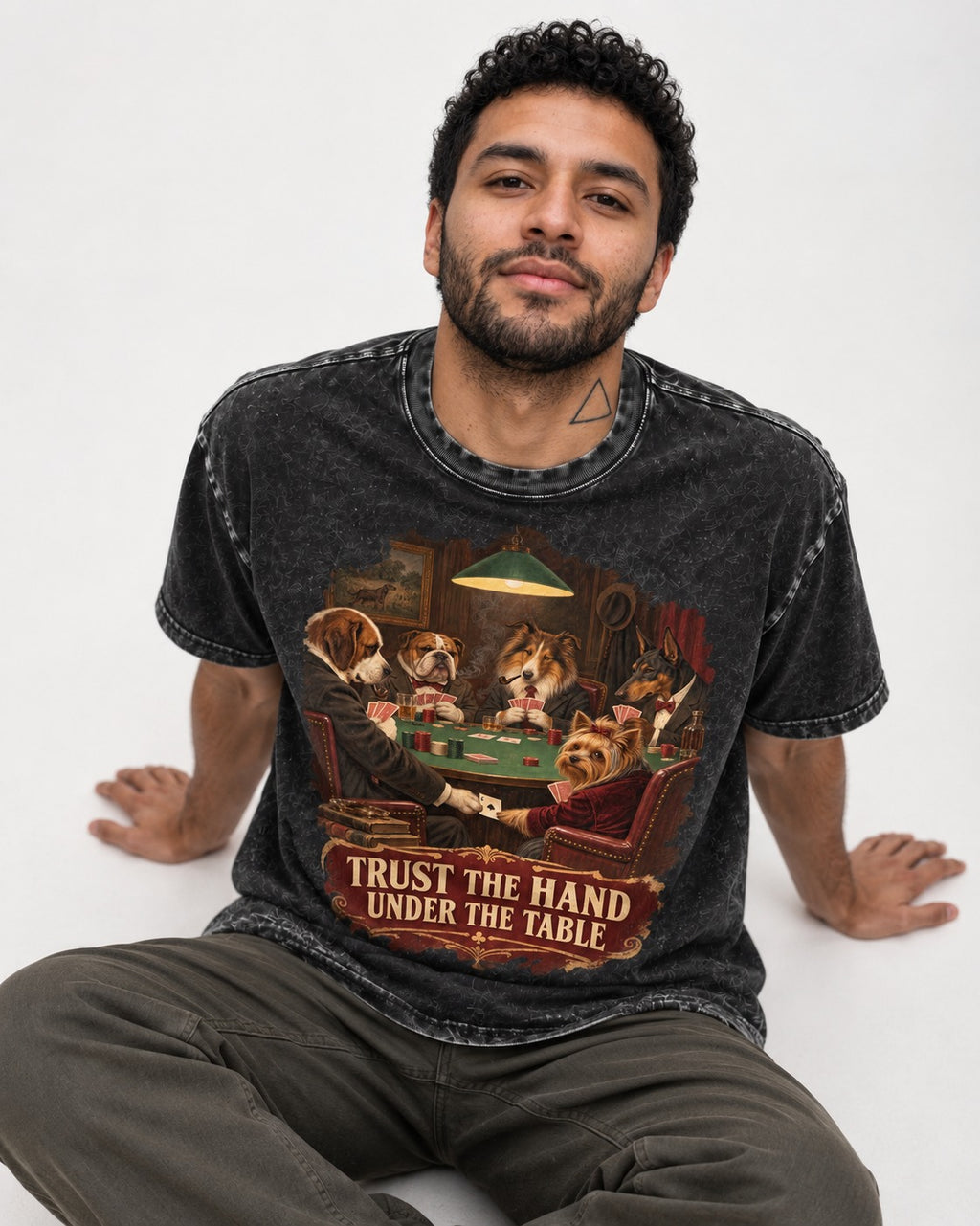 Yorkshire Terrier Trust the Hand Under the Table Poker Dogs Graphic Washed Tee in Black, worn by a seated model