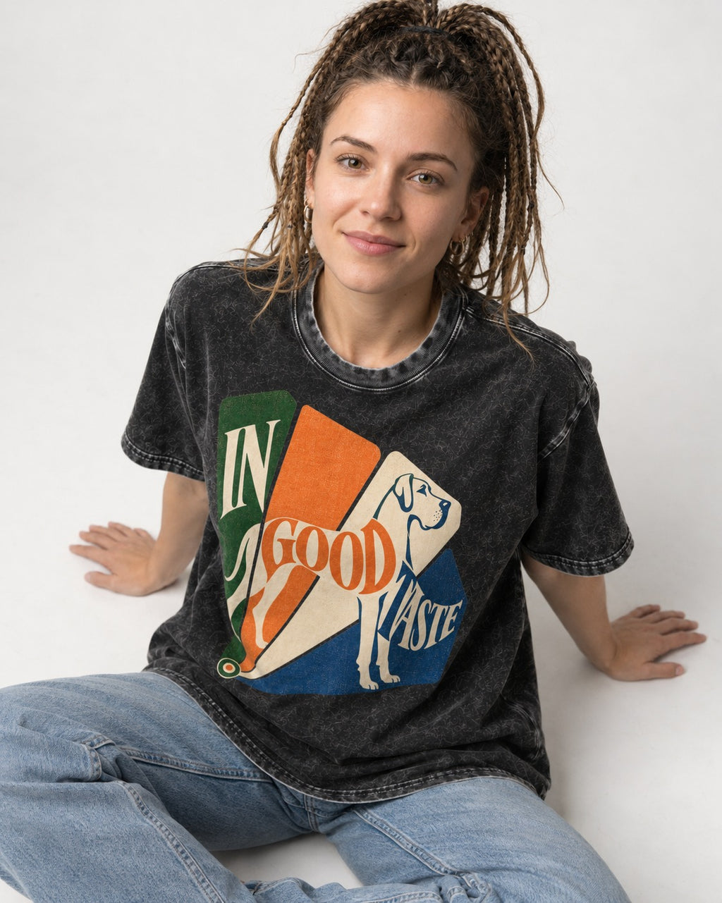 Great Dane In Good Taste Color Fan Graphic Washed Tee in Black, worn by a seated model