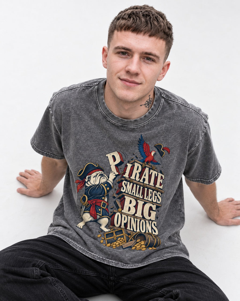 Pirate English Bulldog Big Opinions Washed Tee in Gray, worn by a seated model