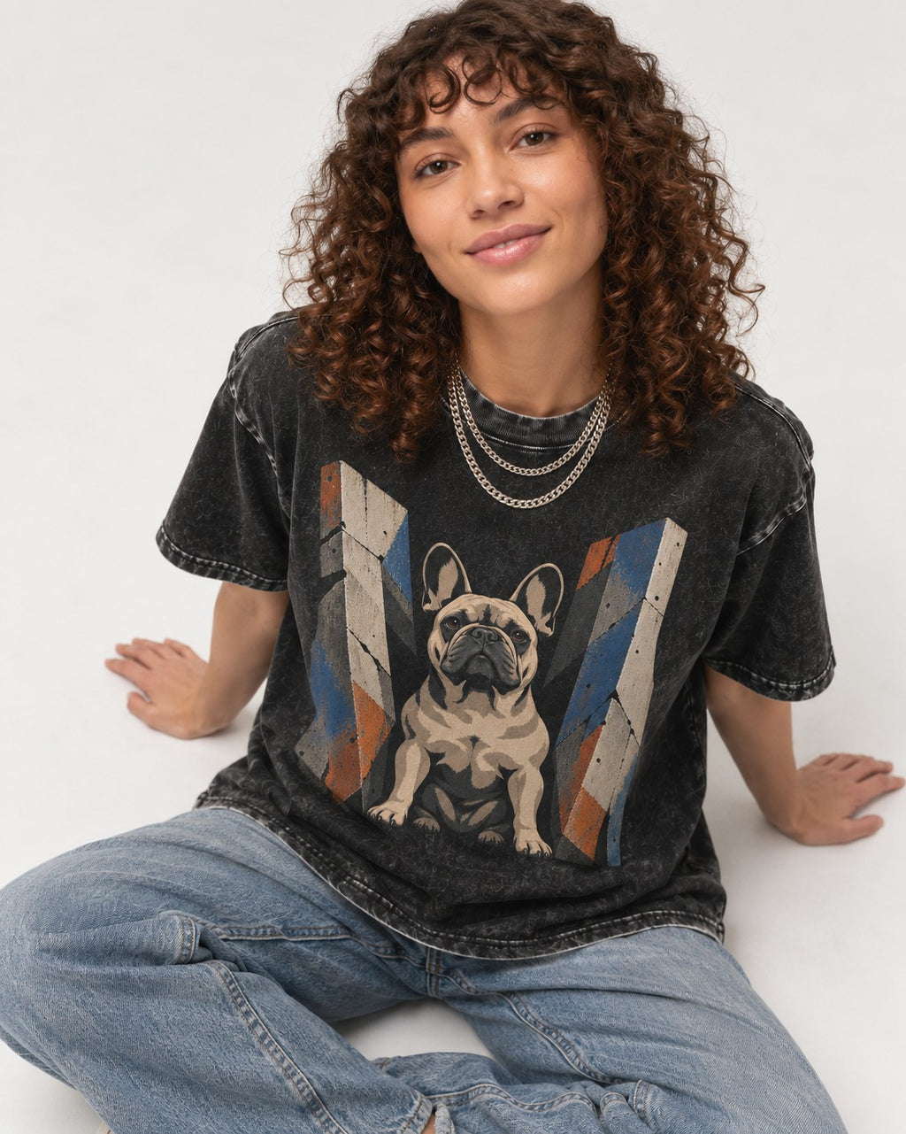 Frenchie Concrete Diplomat Barrier Portrait Washed Tee in Black, worn by a seated model