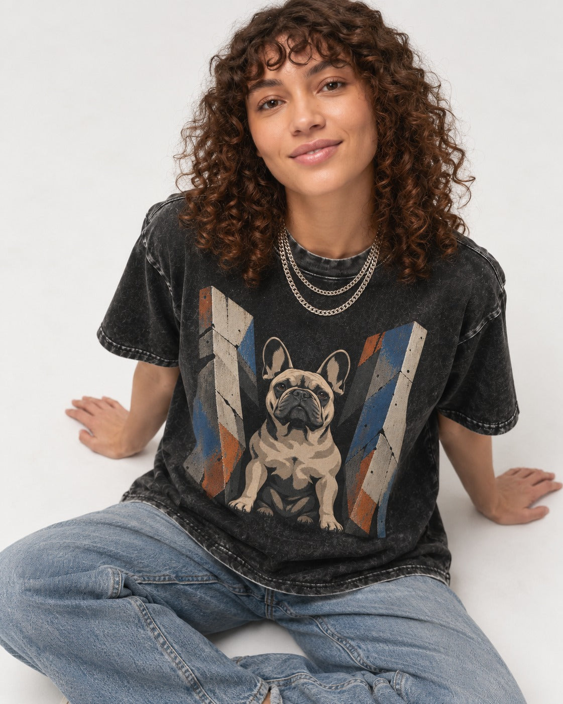 Frenchie Concrete Diplomat Barrier Portrait Washed Tee in Black, worn by a seated model