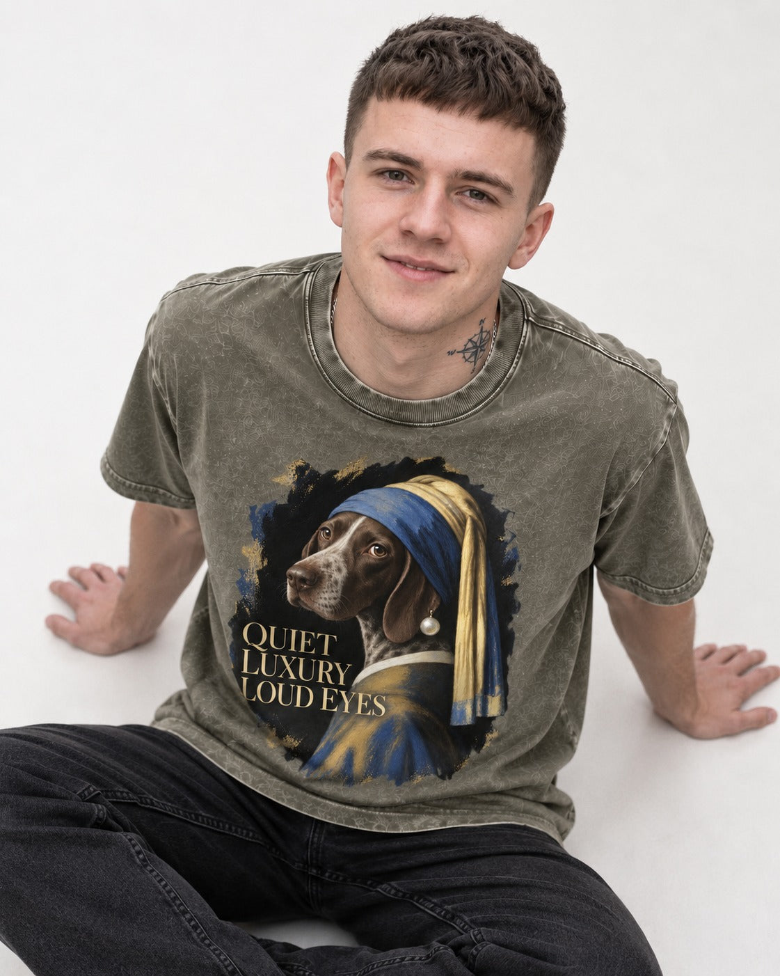 German Shorthaired Pointer Quiet Luxury Loud Eyes Pearl Earring Portrait Graphic Washed Tee in Army Green, worn by a seated model