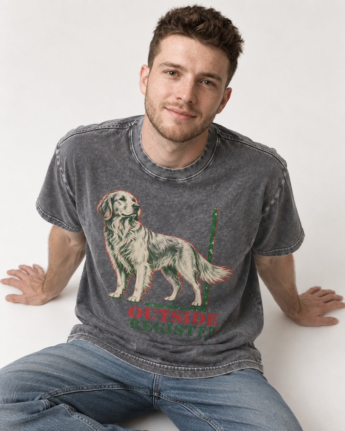 Outside Register Golden Retriever Washed Tee in Gray, worn by a seated model