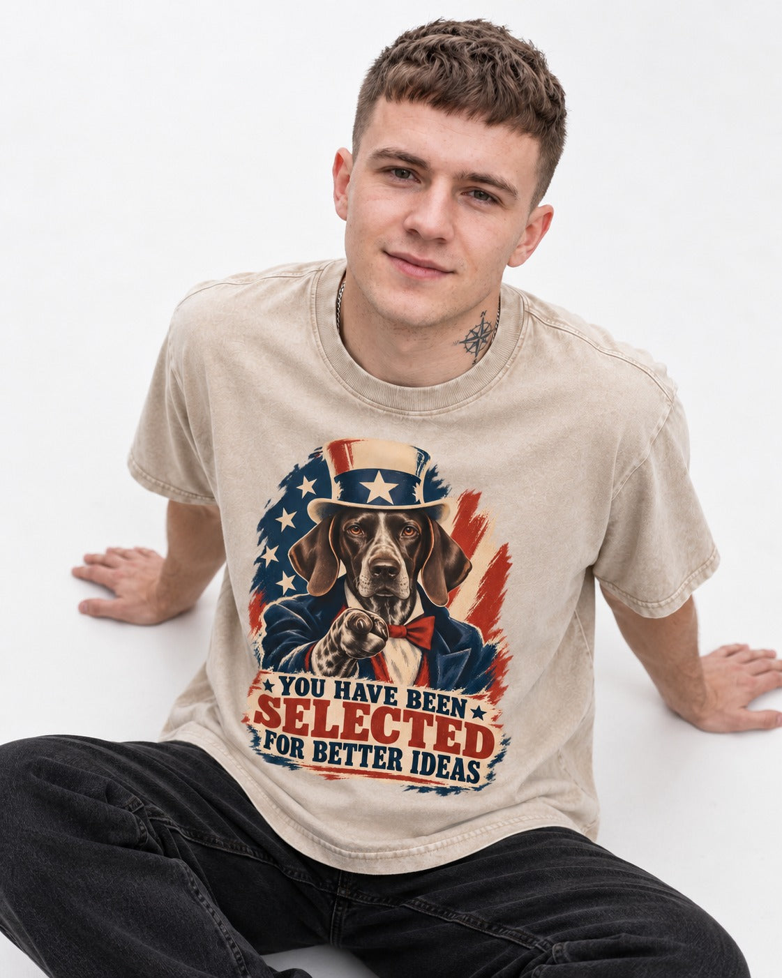 German Shorthaired Pointer You Have Been Selected For Better Ideas Uncle Sam Graphic Washed Tee in Apricot, worn by a seated model