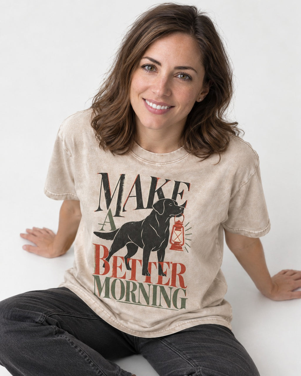 Make a Better Morning Labrador Retriever Washed Tee in Apricot, worn by a seated model