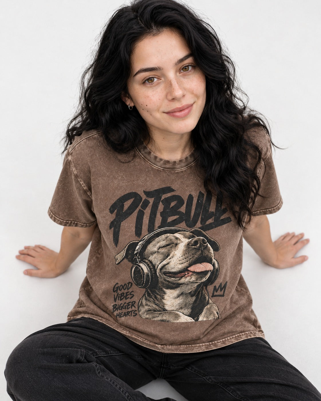 Pitbull Good Vibes Bigger Hearts Washed Tee in Coffee, worn by a seated model