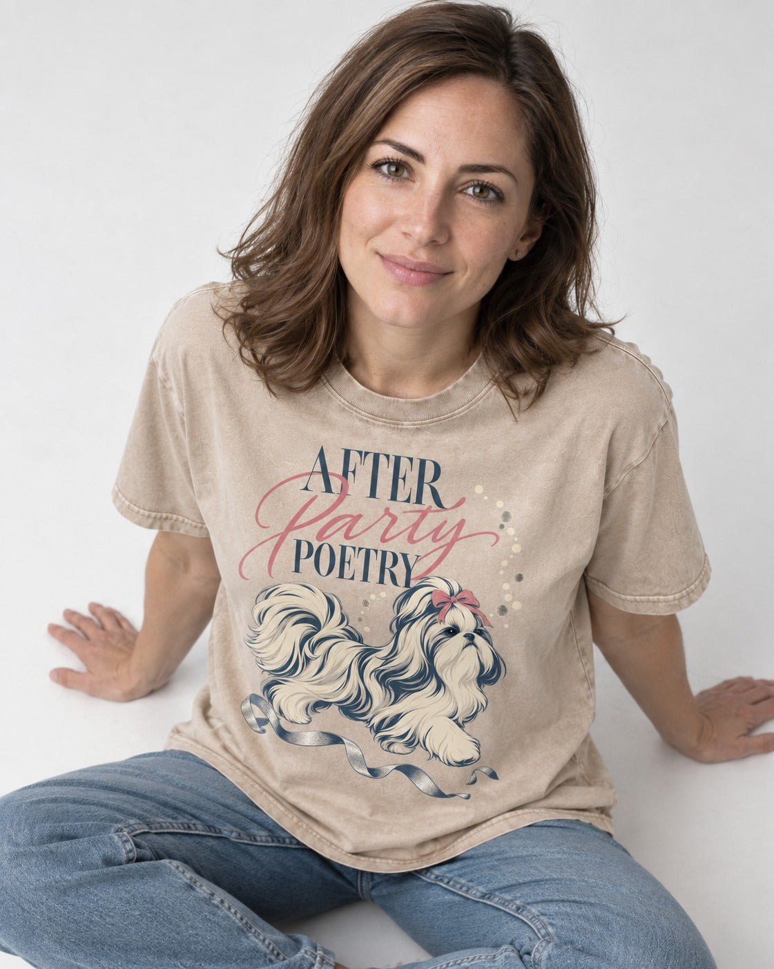 After Party Poetry Shih Tzu Washed Tee in Apricot, worn by a seated model