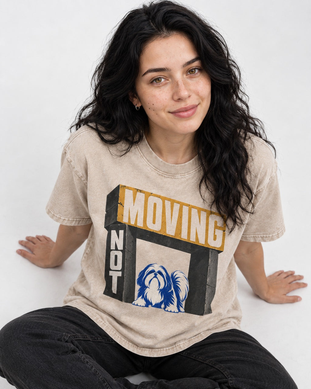 Not Moving Shih Tzu Washed Tee in Apricot, worn by a seated model