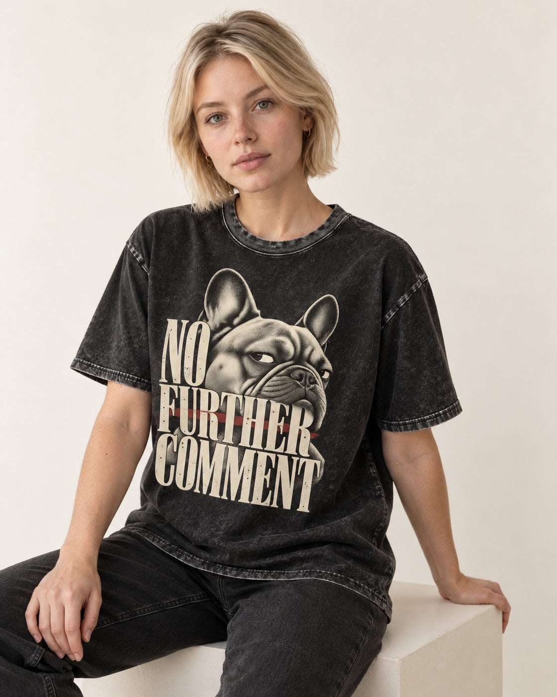 Frenchie No Further Comment Side Eye Graphic Washed Tee in Black, worn by a seated model